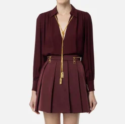 Blusa in georgette con charms collana