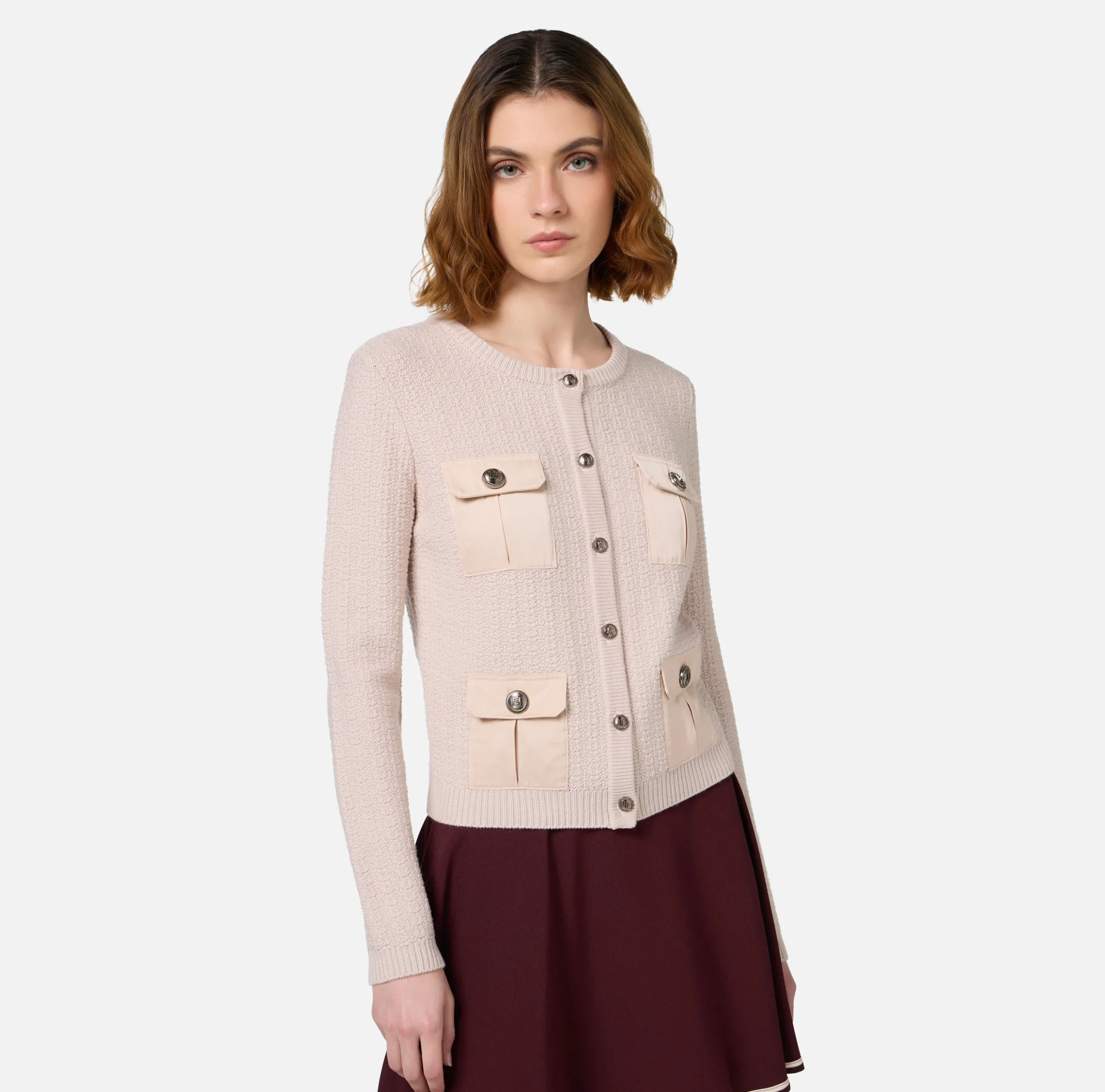 Cardigan in lana bouclé con tasche in vela tecnica