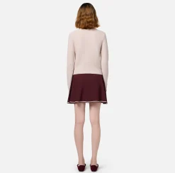 Cardigan in lana bouclé con tasche in vela tecnica