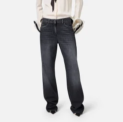 Jeans a gamba larga in cotone organico con bande in raso