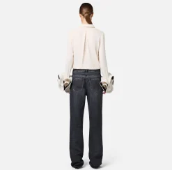 Jeans a gamba larga in cotone organico con bande in raso