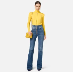 Jeans a zampa in cotone stretch con bottoniera centrale
