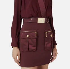 Miniabito con camicia incrociata e gonna con tasche