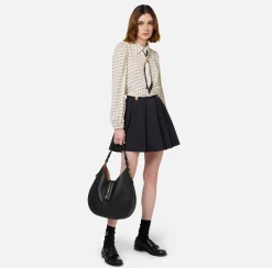 Minigonna a pieghe in nylon tecnico con zip