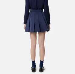 Minigonna a pieghe in nylon tecnico con zip