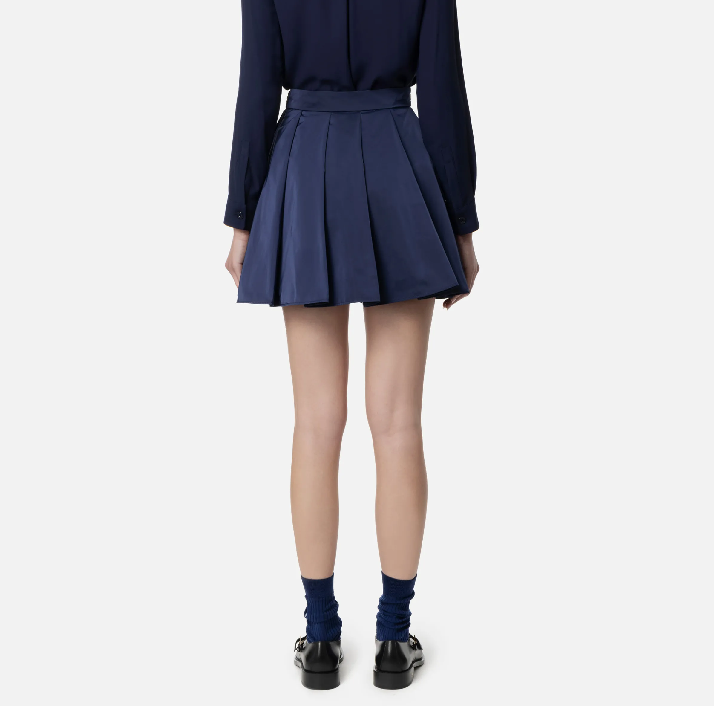 Minigonna a pieghe in nylon tecnico con zip