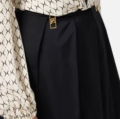 Minigonna a pieghe in nylon tecnico con zip