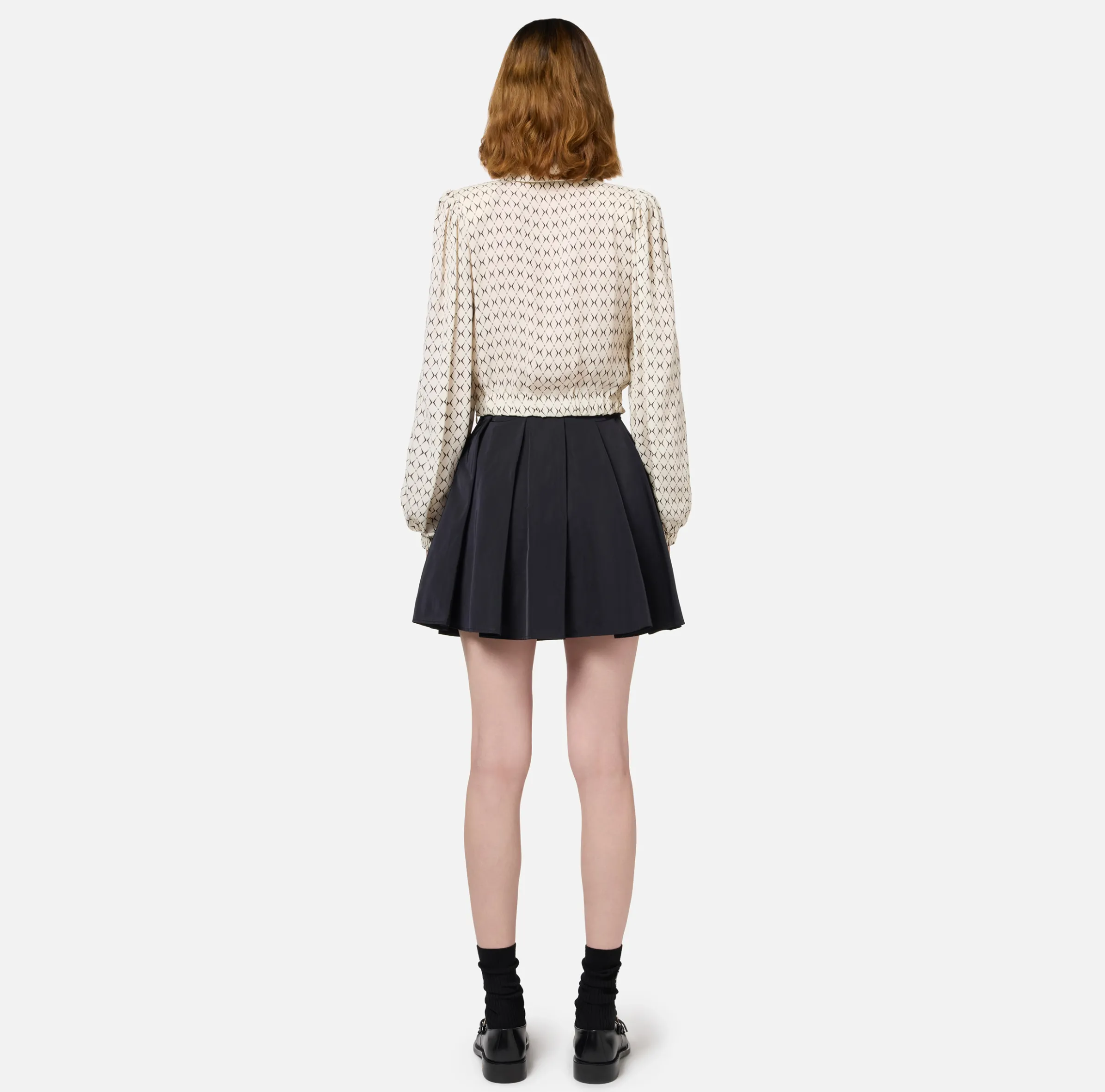 Minigonna a pieghe in nylon tecnico con zip