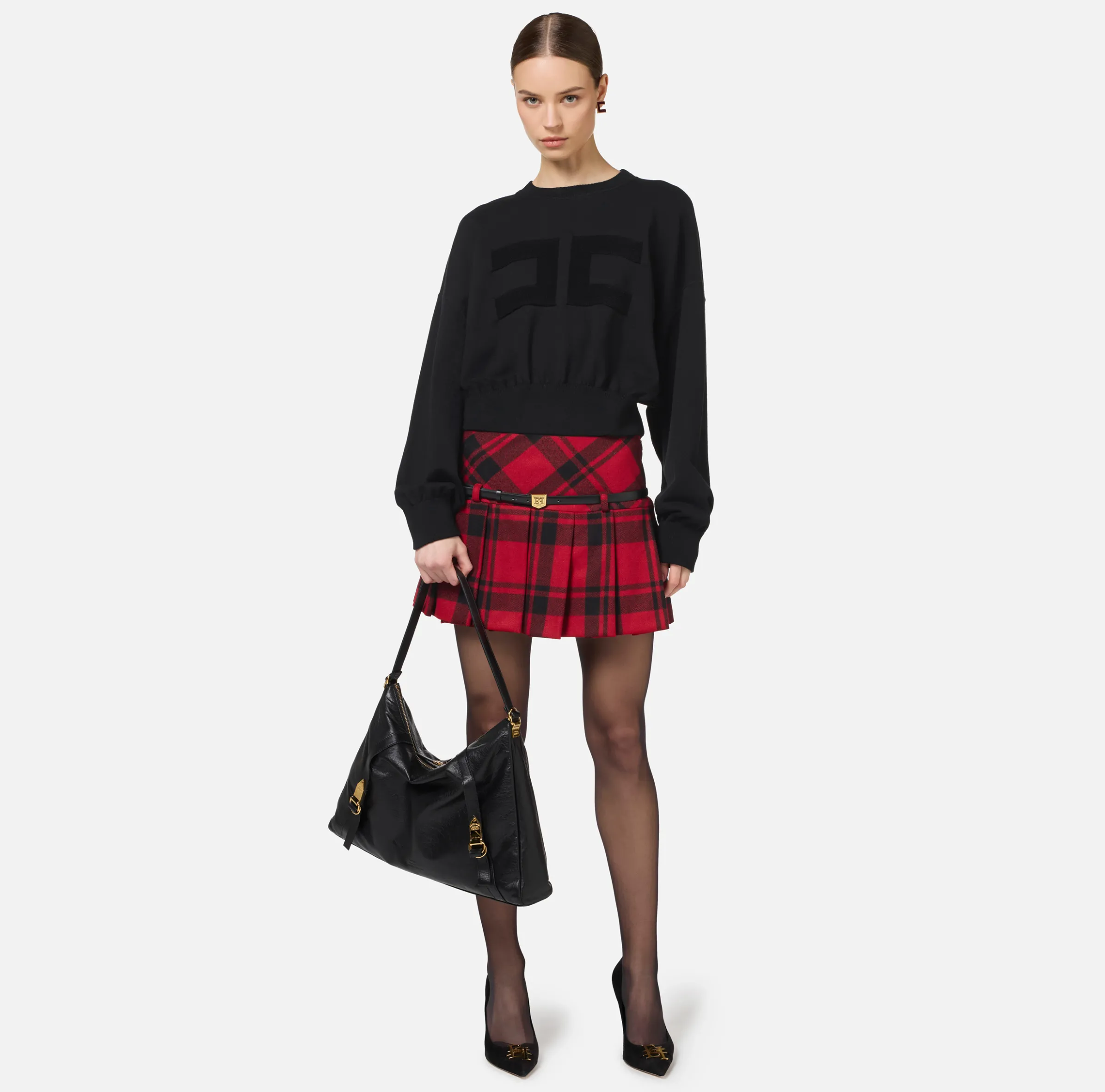 Minigonna a pieghe in tartan di lana