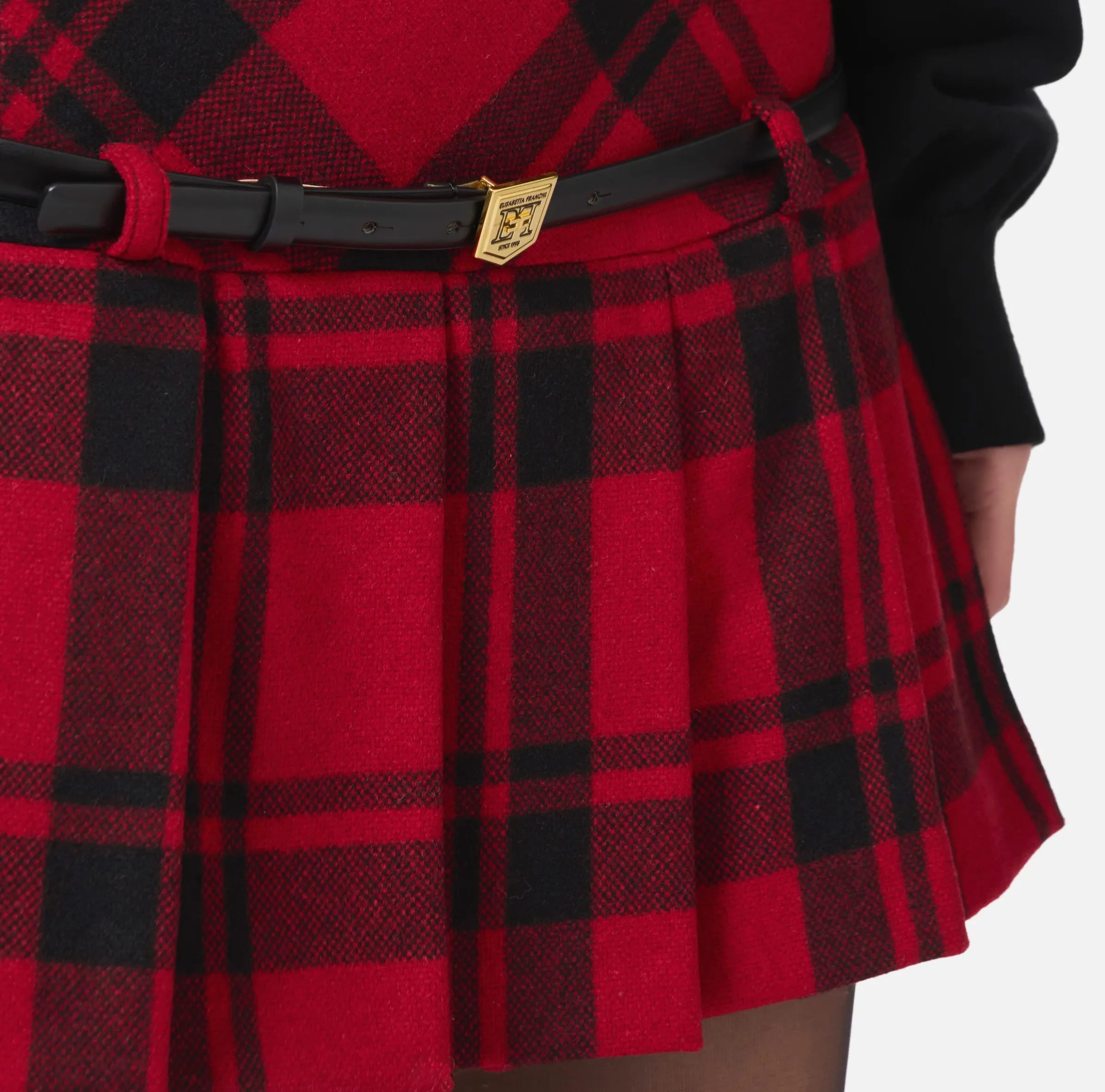 Minigonna a pieghe in tartan di lana
