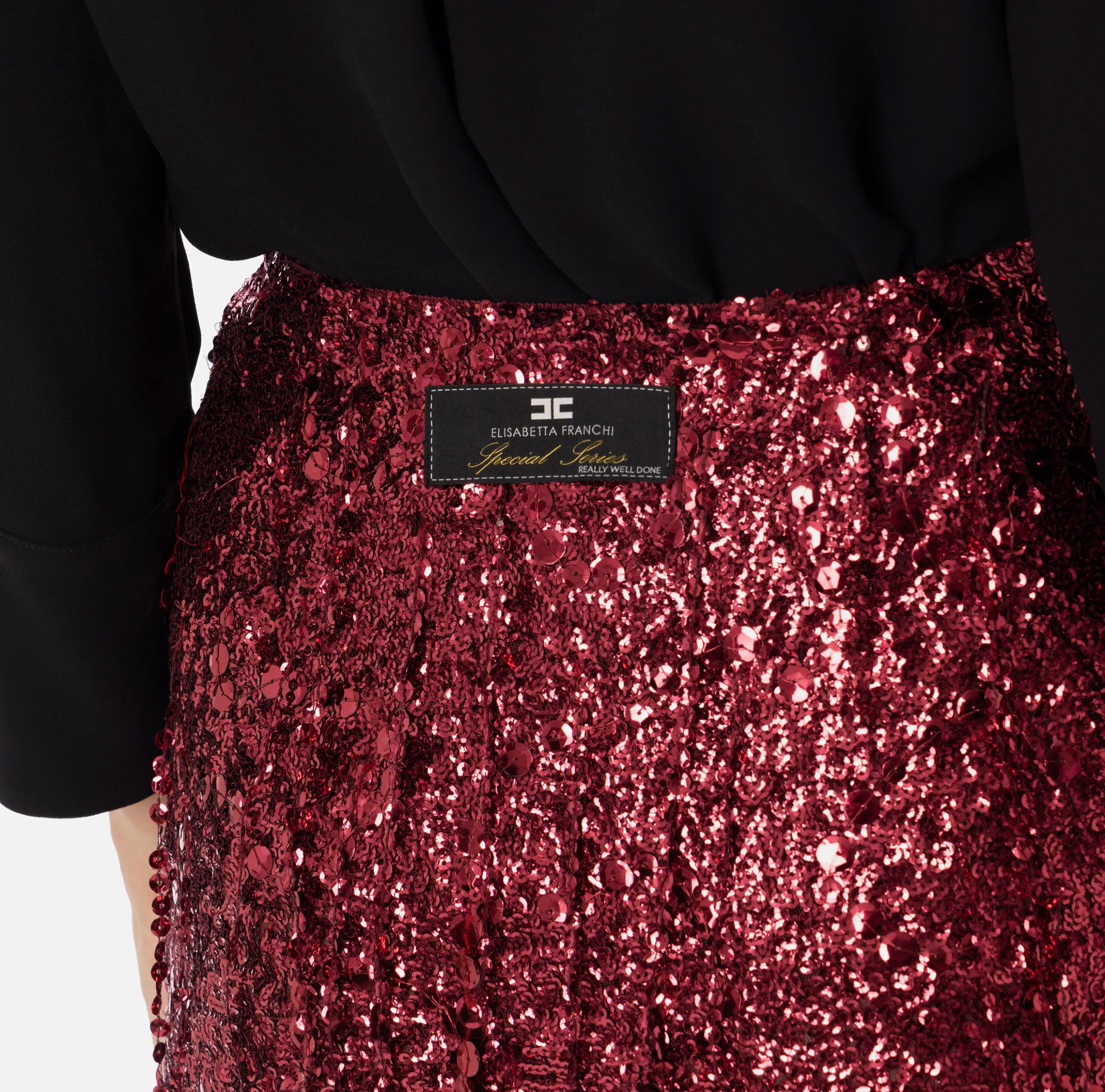Minigonna in tulle ricamata con frange di paillettes