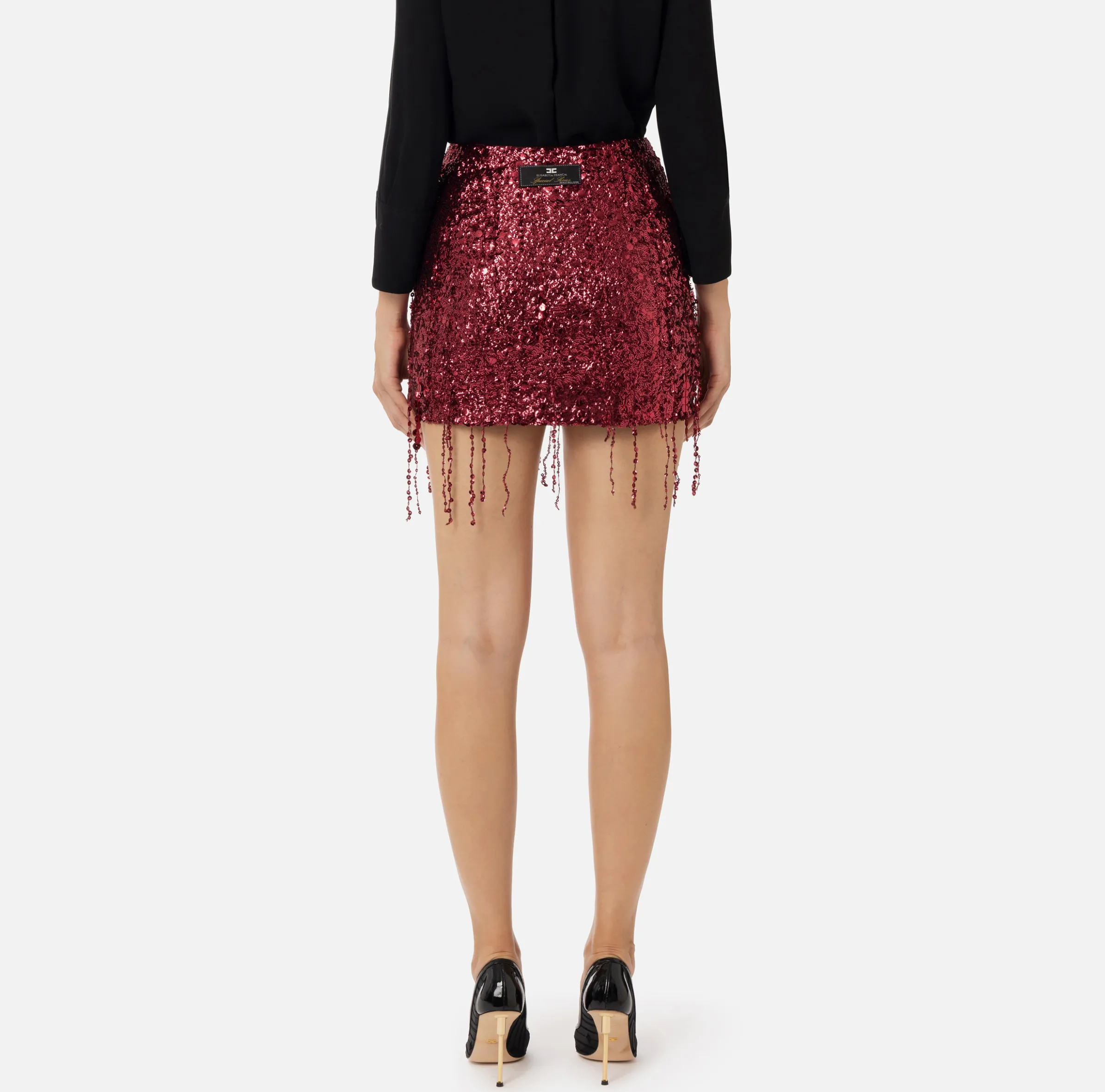 Minigonna in tulle ricamata con frange di paillettes
