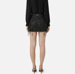 Minigonna in tulle ricamata con frange di paillettes