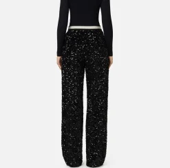 Pantalone in ciniglia ricamata con paillettes
