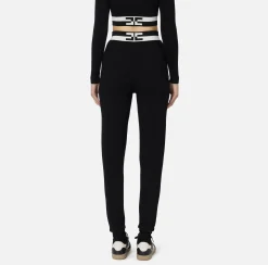 Pantalone jogger in viscosa con bande logo