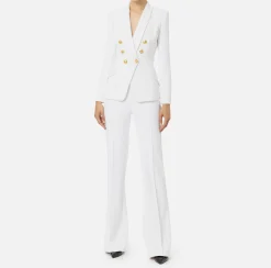 Tailleur in doppio crêpe stretch con giacca sciallata e pantalone a palazzo
