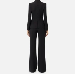 Tailleur in doppio crêpe stretch con giacca sciallata e pantalone a palazzo