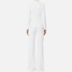 Tailleur in doppio crêpe stretch con giacca sciallata e pantalone a palazzo