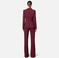 Tailleur in doppio crêpe stretch con giacca sciallata e pantalone a palazzo