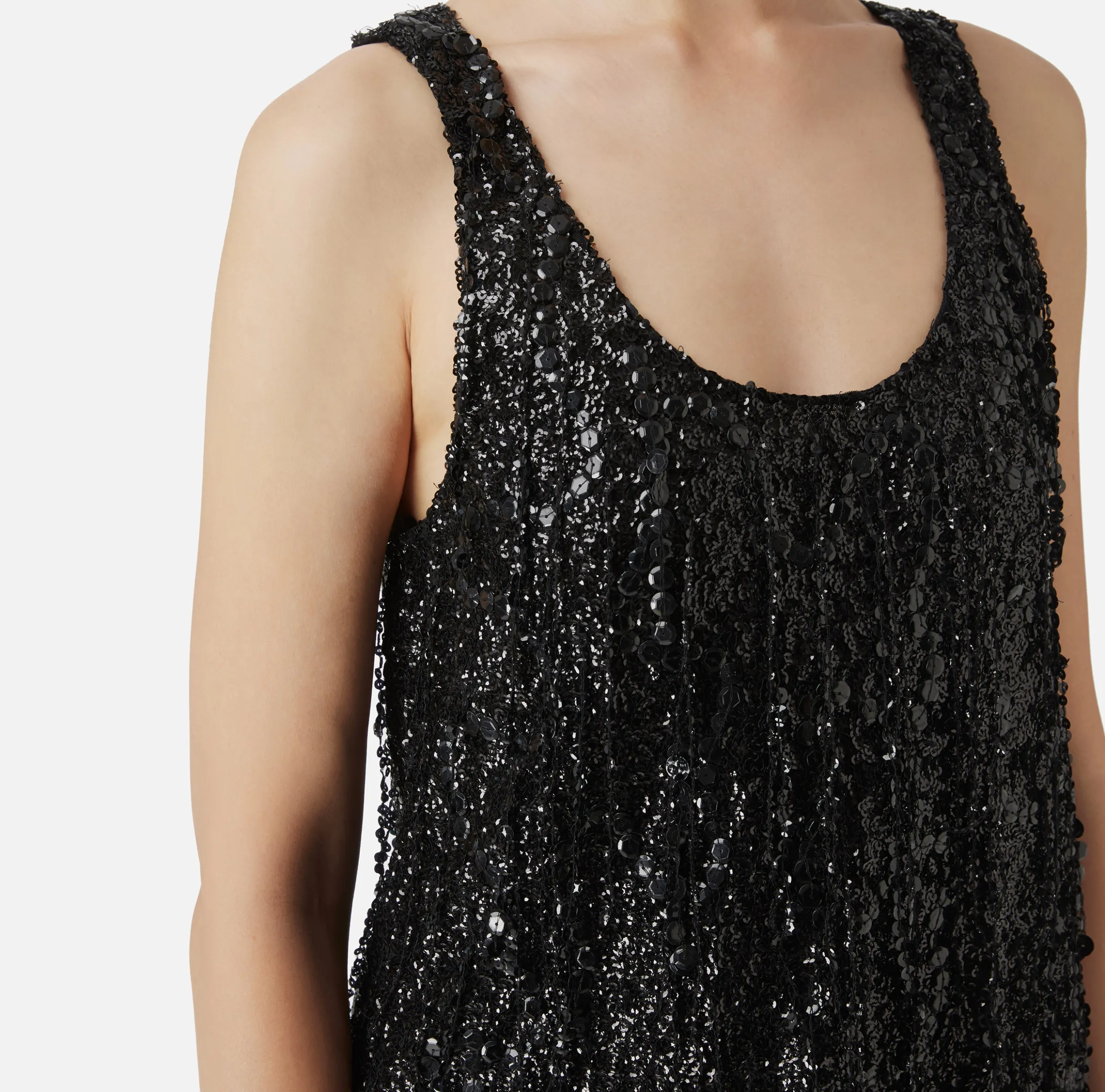 Top in tulle ricamato con frange di paillettes