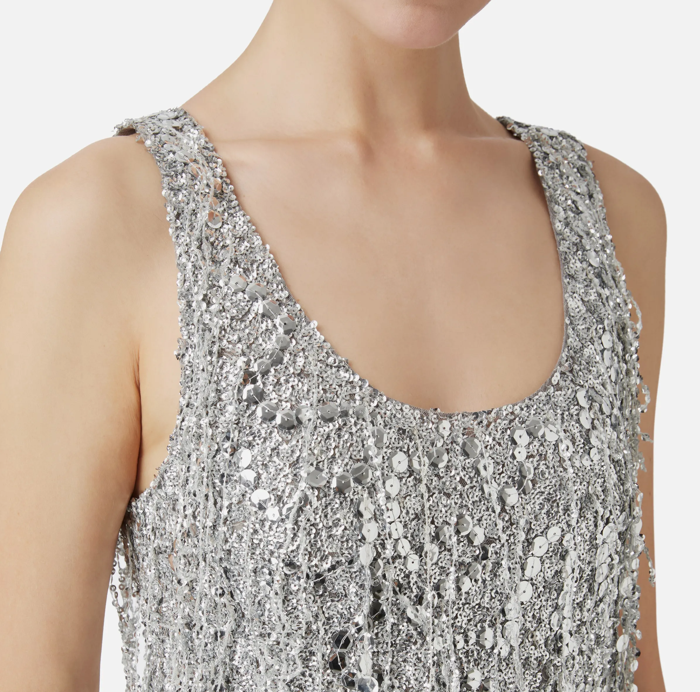 Top in tulle ricamato con frange di paillettes