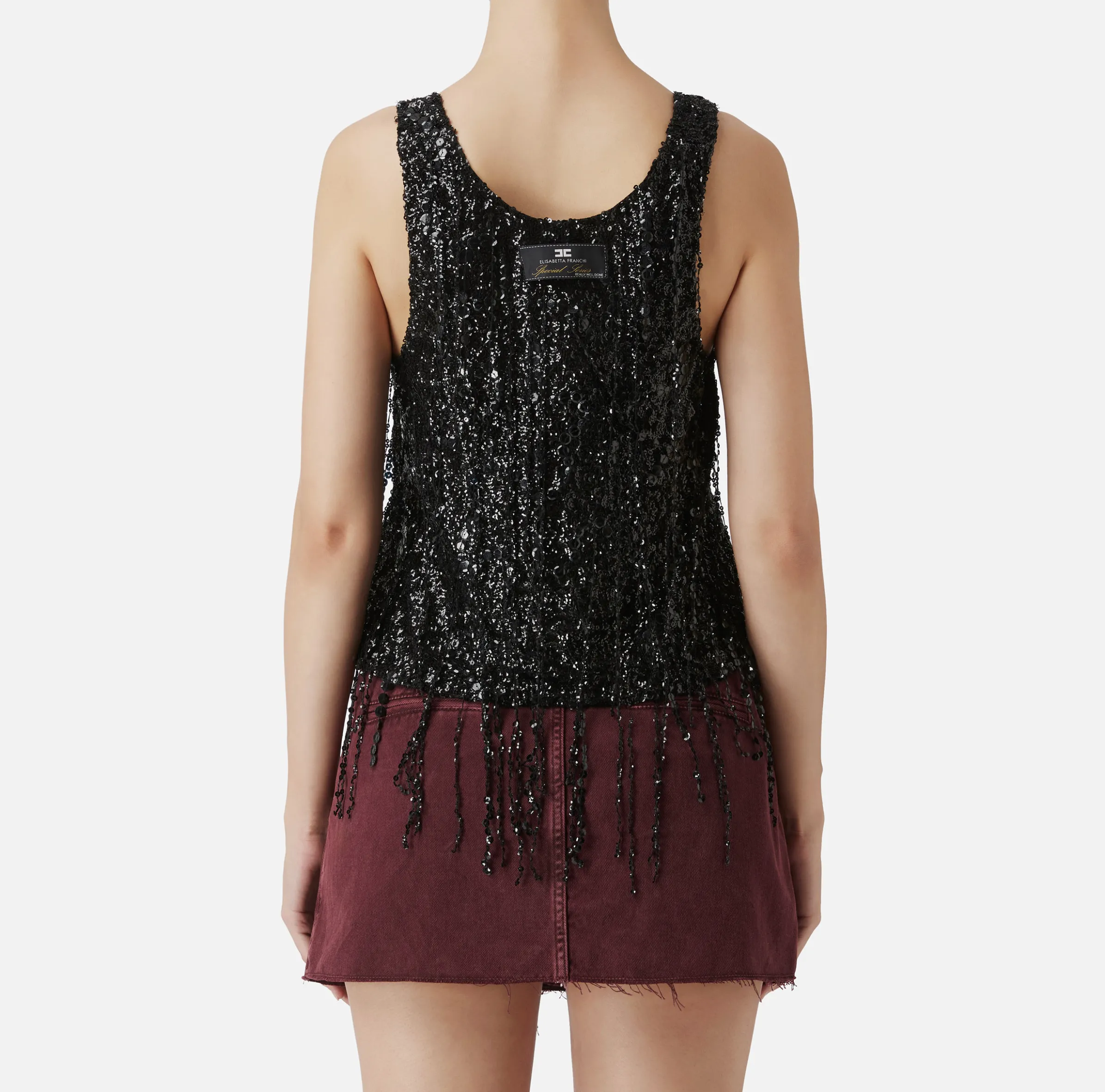 Top in tulle ricamato con frange di paillettes