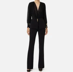 Tuta in crêpe con blusa in georgette e baschina