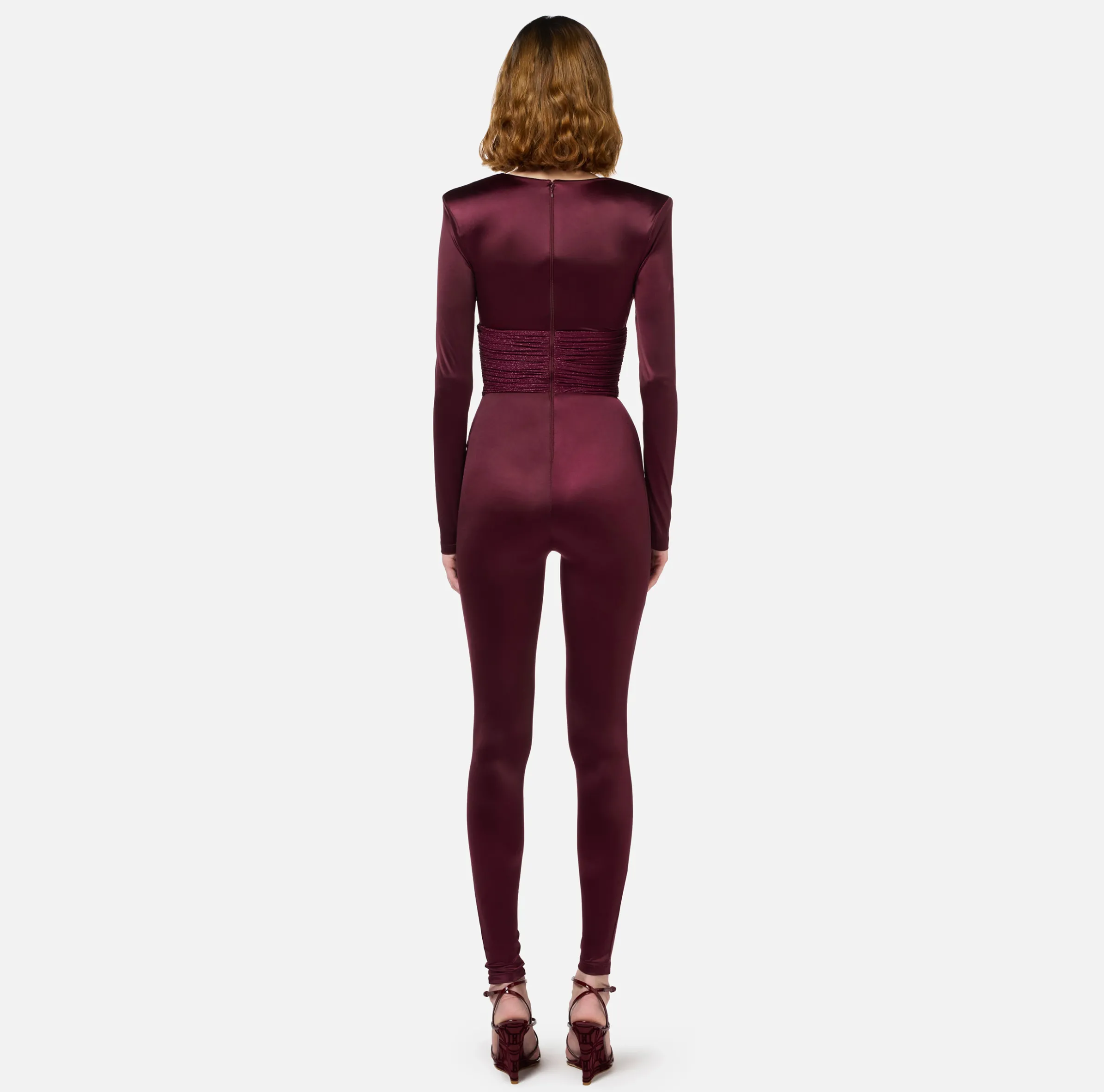 Tuta in lycra lucida con inserti plissé