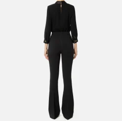 Tuta in viscosa con camicia incrociata e pantalone svasato con morsetto